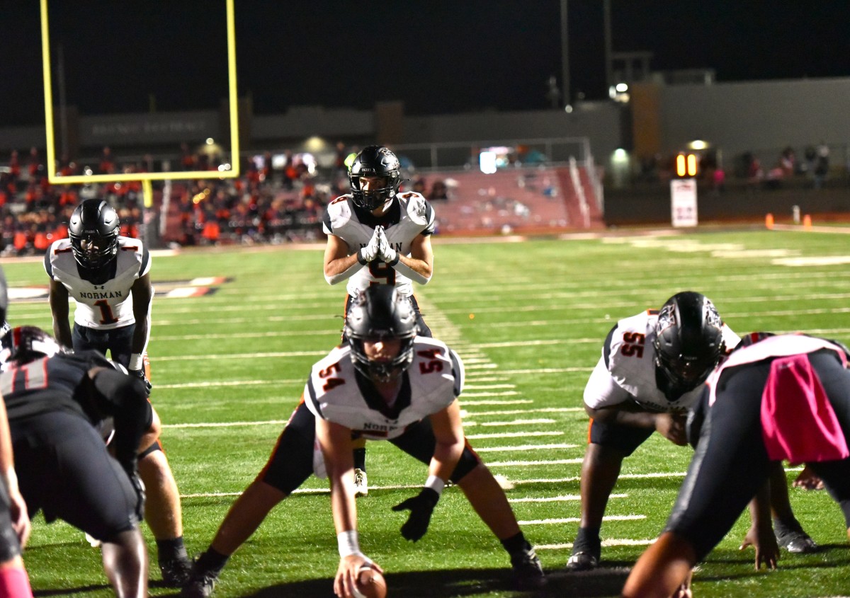Norman High senior Dax Noles lines up at quarterback during the Tigers' game at Mustang on Oct. 20, 2023. 
